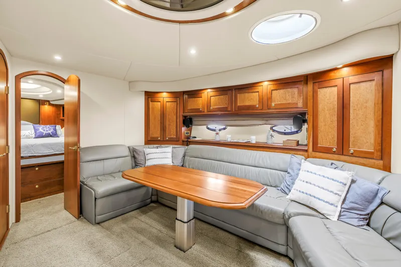  Yacht Photos Pics Luxurious 2002 Cruisers 5370 yacht interior with elegant wood cabinetry and plush seating.