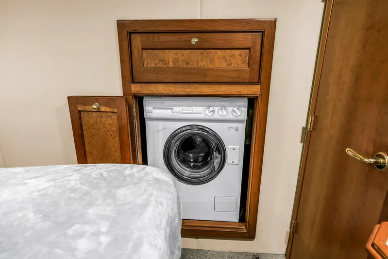  Yacht Photos Pics Built-in washing machine in wooden cabinet on 2002 Cruisers 5370 yacht.