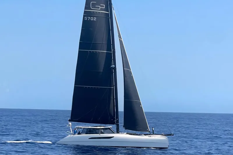 Vandal Yacht Photos Pics 2014 Gunboat 55 sailing on open ocean under clear blue sky.