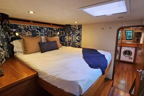 Vandal Yacht Photos Pics Luxurious bedroom interior of 2014 Gunboat 55 yacht with elegant bedding and wood accents.