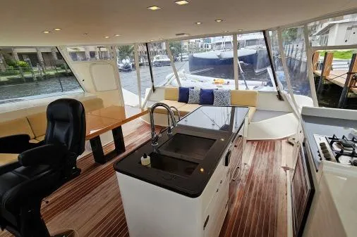 Vandal Yacht Photos Pics Interior of 2014 Gunboat 55 yacht with modern kitchen and seating area.