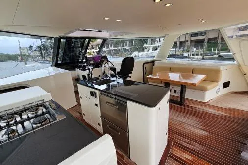 Vandal Yacht Photos Pics Interior of 2014 Gunboat 55 yacht with modern kitchen and seating area.