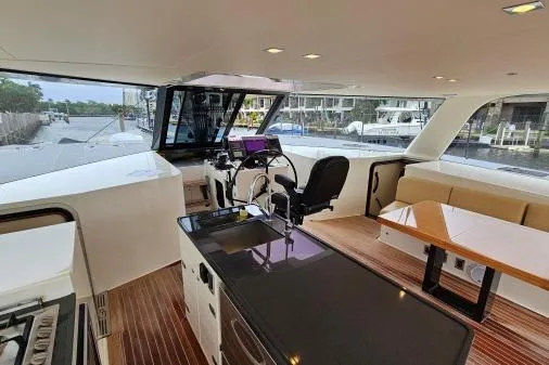 Vandal Yacht Photos Pics Interior of 2014 Gunboat 55 yacht with modern helm, seating, and sleek design.