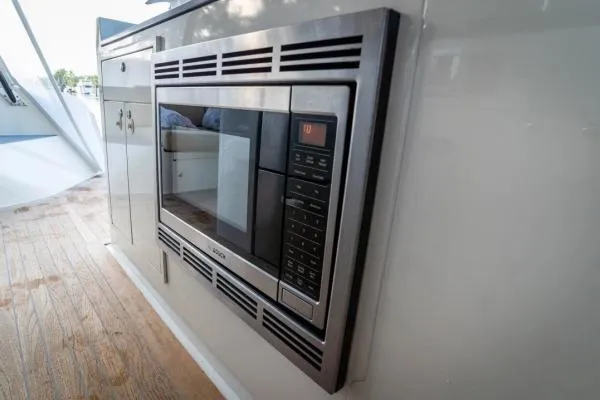 Vandal Yacht Photos Pics Built-in microwave on 2014 Gunboat 55 yacht, featuring sleek stainless steel design.