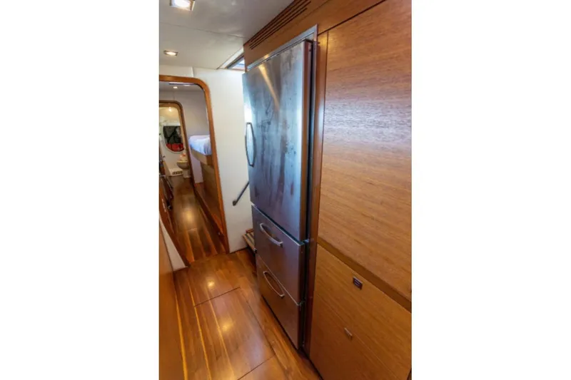 Vandal Yacht Photos Pics Interior of 2014 Gunboat 55 yacht with wooden flooring and modern refrigerator.