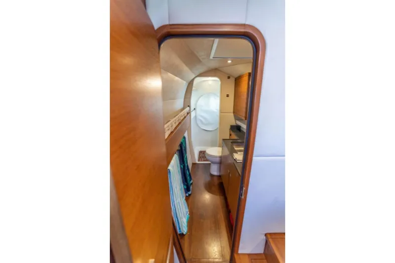 Vandal Yacht Photos Pics Interior view of 2014 Gunboat 55 yacht bathroom with wooden finishes and modern amenities.