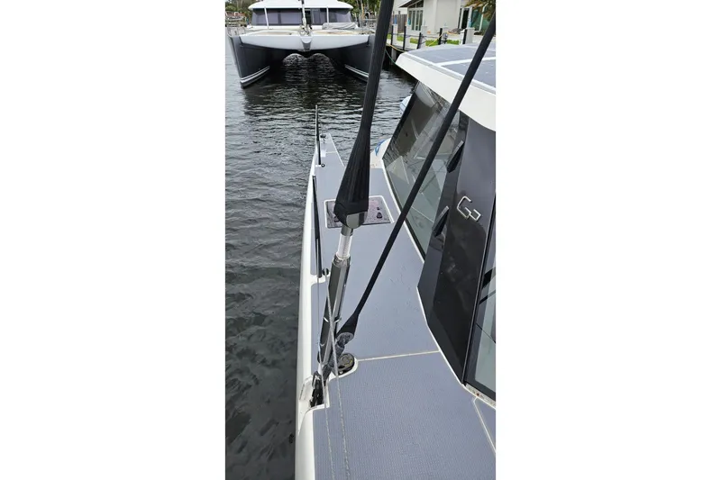 Vandal Yacht Photos Pics 2014 Gunboat 55 catamaran docked, showcasing sleek design and modern features.