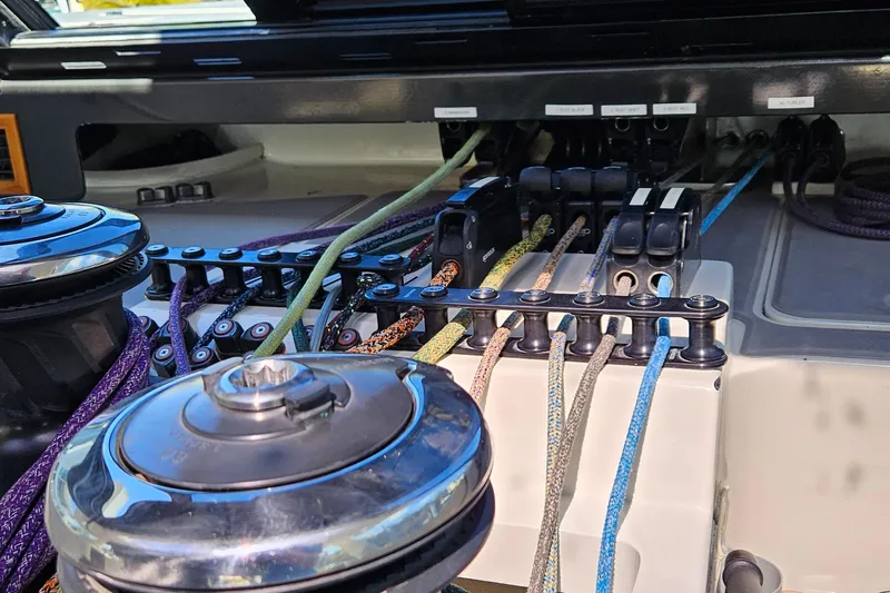 Vandal Yacht Photos Pics Sailing rigging system on a 2014 Gunboat 55 yacht, featuring colorful ropes and winches.