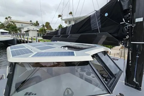 Vandal Yacht Photos Pics 2014 Gunboat 55 yacht with solar panels on deck, docked in a marina.