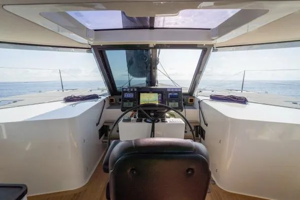 Vandal Yacht Photos Pics Cockpit view of 2014 Gunboat 55 yacht with navigation equipment and ocean backdrop.