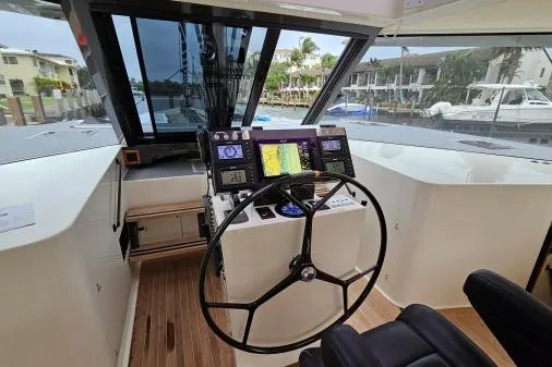Vandal Yacht Photos Pics Helm of 2014 Gunboat 55 yacht with navigation instruments and steering wheel.