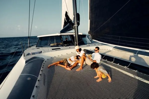 Vandal Yacht Photos Pics Family relaxing on 2014 Gunboat 55 catamaran, enjoying the ocean view.