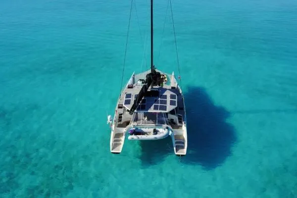 Vandal Yacht Photos Pics 2014 Gunboat 55 catamaran with solar panels on turquoise water.