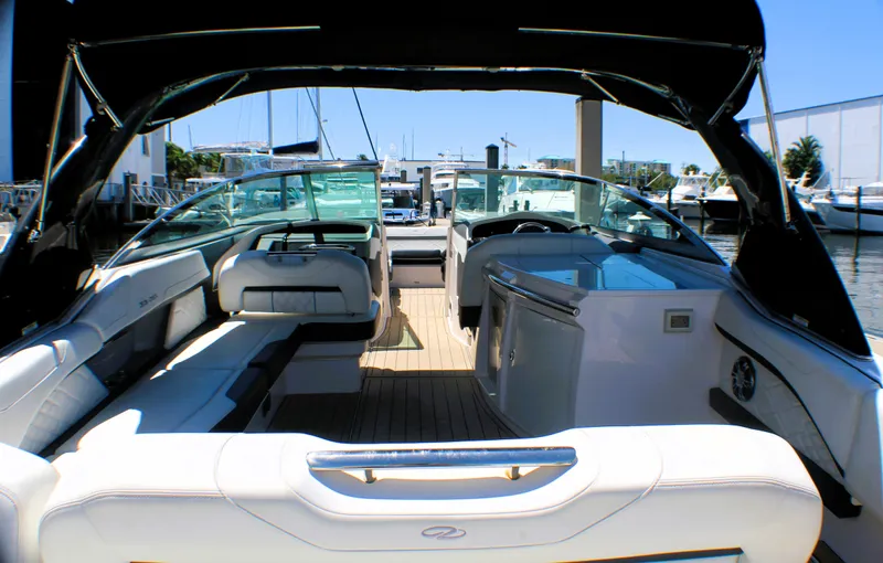 Sea M.a.j.i.c. Yacht Photos Pics 2022 Regal 33 OBX boat interior with luxurious seating and modern design.