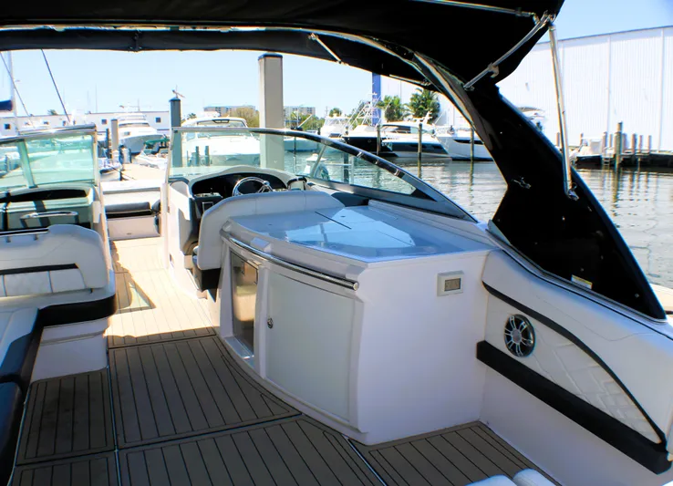 Sea M.a.j.i.c. Yacht Photos Pics 2022 Regal 33 OBX boat interior with sleek design and modern amenities at a marina.