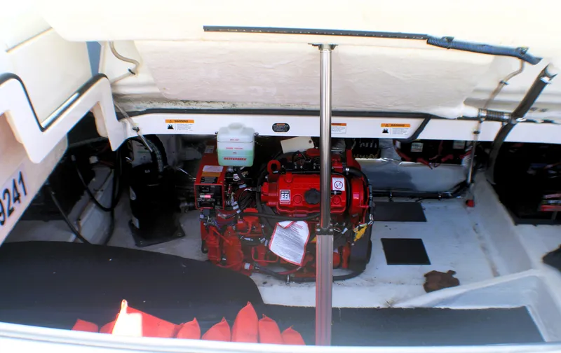 Sea M.a.j.i.c. Yacht Photos Pics 2022 Regal 33 OBX engine compartment with visible red engine and equipment.