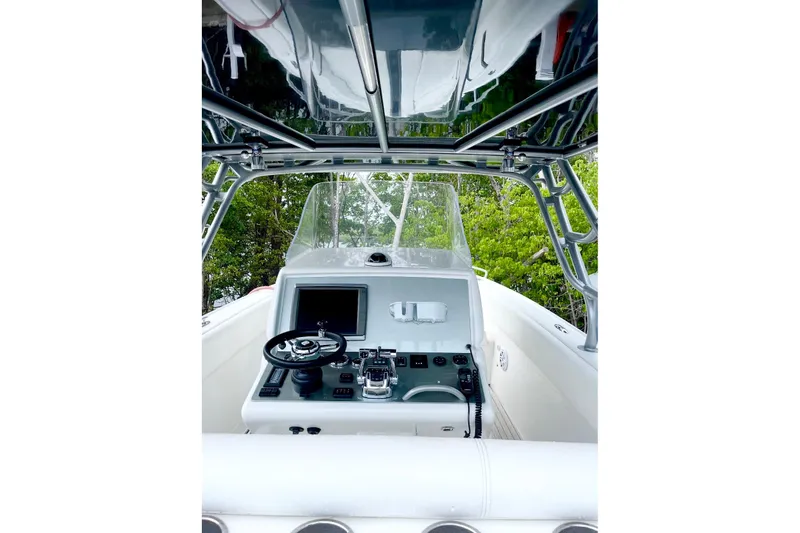  Yacht Photos Pics Cockpit view of 2013 Midnight Express 39S Open boat with steering and controls.