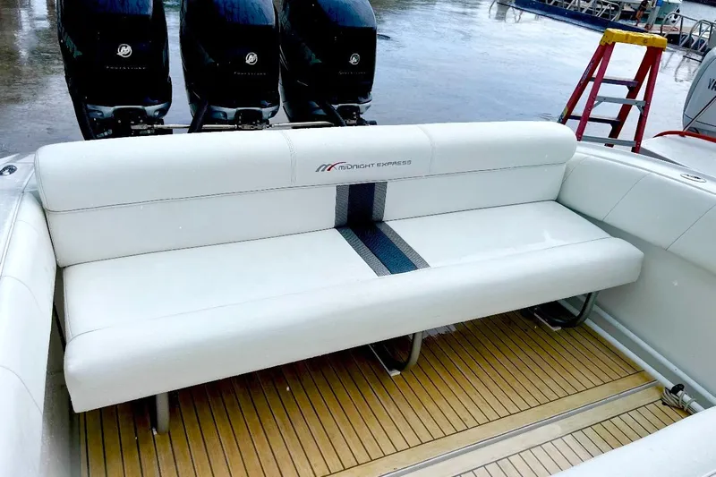  Yacht Photos Pics 2013 Midnight Express 39S Open boat with white seating and triple Mercury outboard engines.