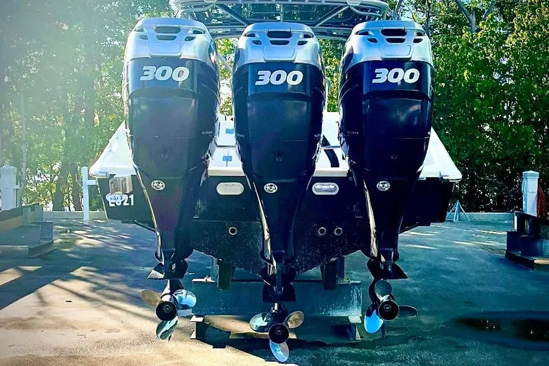  Yacht Photos Pics 2013 Midnight Express 39S Open with triple 300 horsepower engines, docked outdoors.