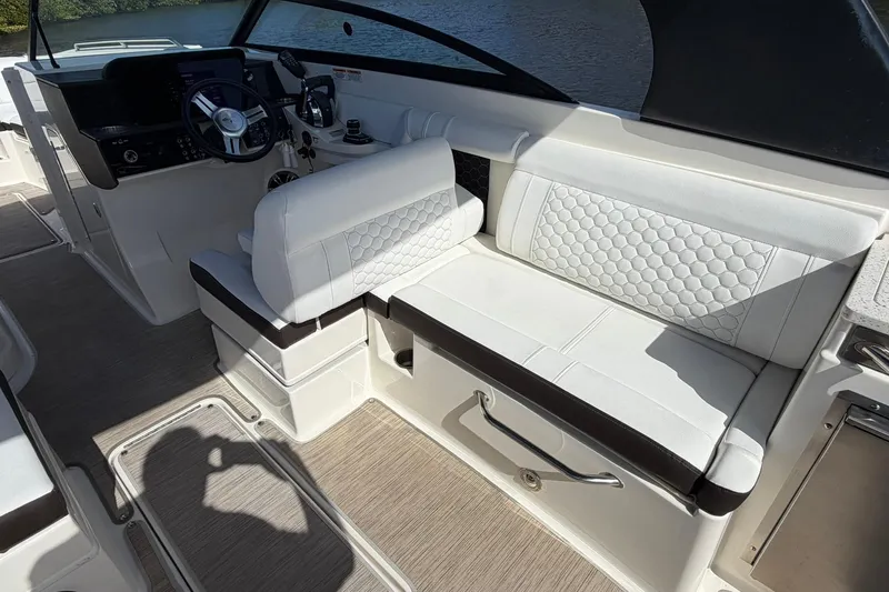  Yacht Photos Pics 2020 Sea Ray SDX 290 Outboard interior with white seating and steering console.