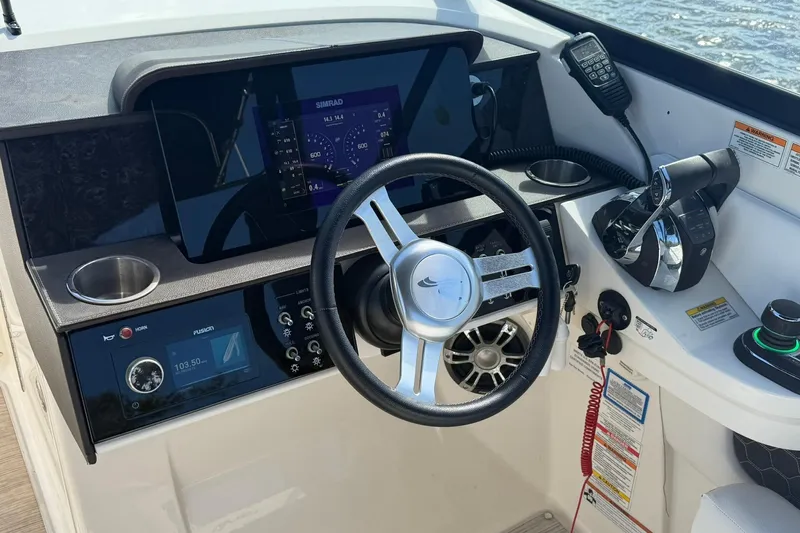  Yacht Photos Pics 2020 Sea Ray SDX 290 Outboard helm with steering wheel, controls, and navigation display.