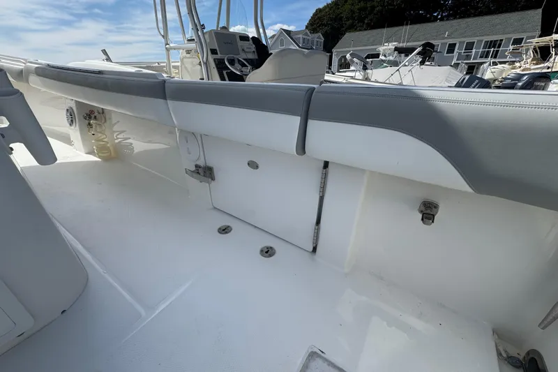  Yacht Photos Pics 2022 Regulator 31 boat interior with white deck and gray cushioned seating.