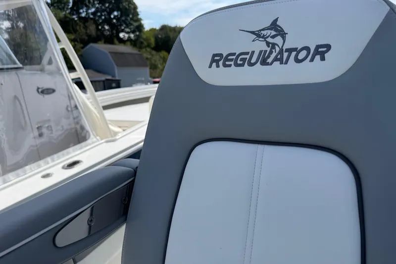  Yacht Photos Pics 2022 Regulator 31 boat seat with logo, featuring sleek design and marlin graphic.