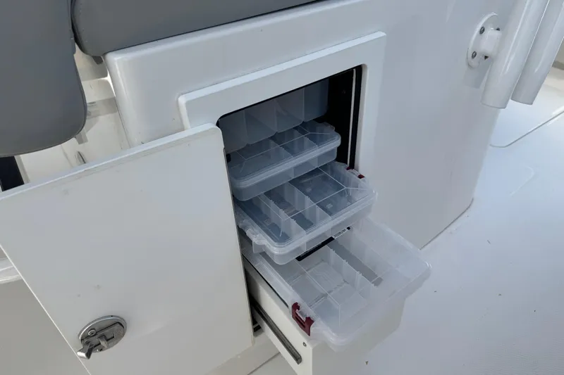  Yacht Photos Pics Storage compartment with tackle boxes on a 2022 Regulator 31 boat.
