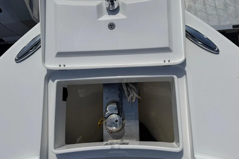  Yacht Photos Pics Open anchor locker on 2022 Regulator 31 boat, showcasing storage and equipment.