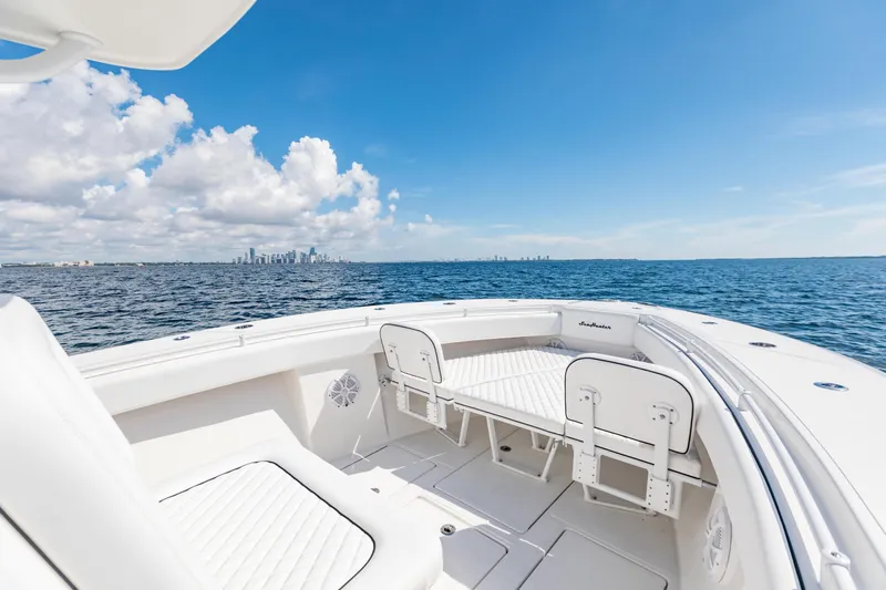  Yacht Photos Pics 2020 SeaHunter 33 Tournament boat with ocean view and city skyline in the distance.