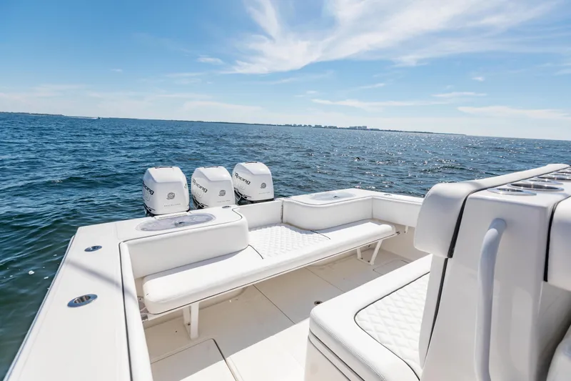  Yacht Photos Pics 2020 SeaHunter 33 Tournament boat with triple engines on open water.