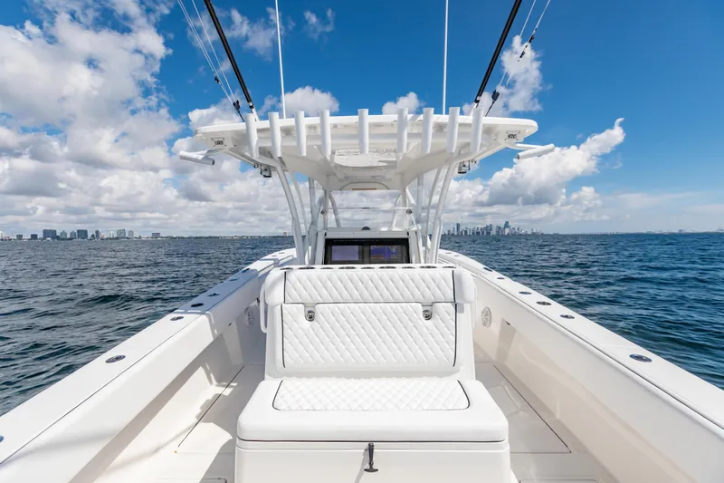  Yacht Photos Pics 2020 SeaHunter 33 Tournament boat on open water with city skyline in background.