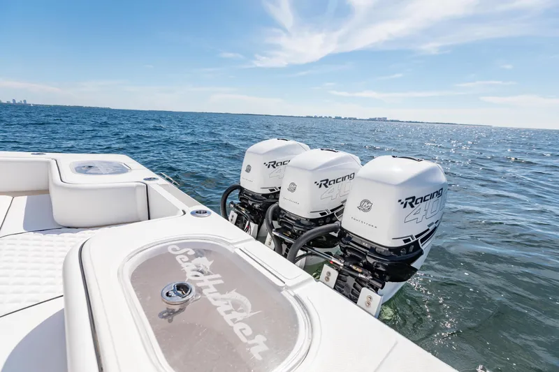  Yacht Photos Pics 2020 SeaHunter 33 Tournament boat with triple Racing 400 engines on open water.
