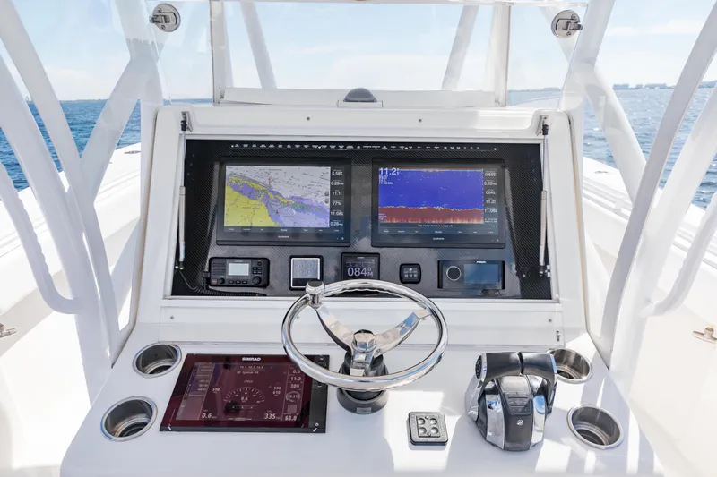  Yacht Photos Pics 2020 SeaHunter 33 Tournament boat dashboard with navigation screens and controls.