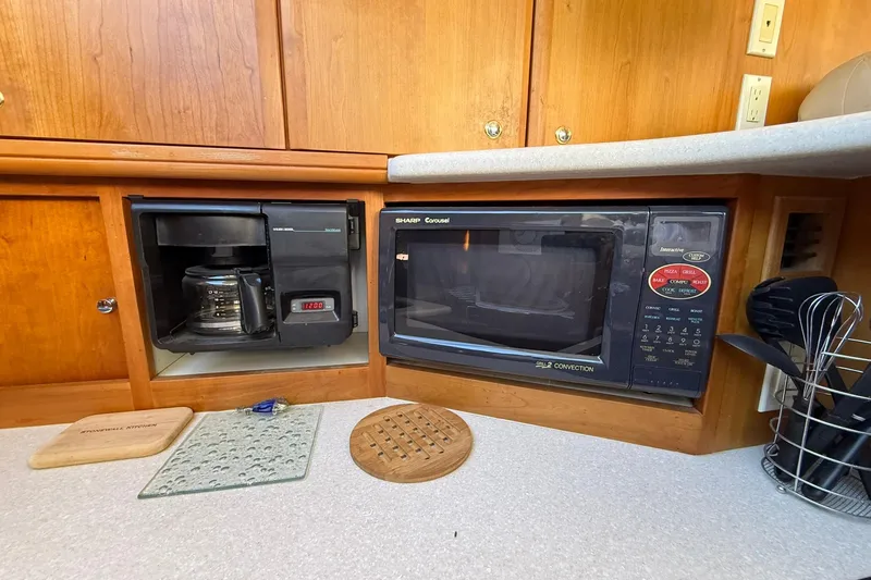 Reelin N Rockin Yacht Photos Pics 2003 Silverton 38 Convertible kitchen with coffee maker and microwave.