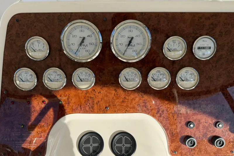 Reelin N Rockin Yacht Photos Pics Dashboard of a 2003 Silverton 38 Convertible boat with various gauges and controls.
