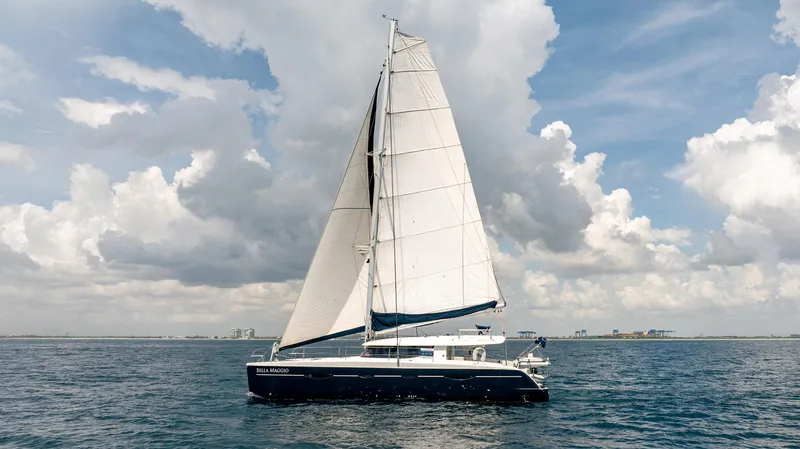 Bellamaggio Yacht Photos Pics Sailing catamaran Fountaine Pajot Salina 48 Evolution, 2008, on open water under cloudy sky.