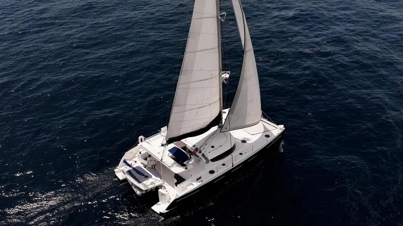 Bellamaggio Yacht Photos Pics Aerial view of 2008 Fountaine Pajot Salina 48 Evolution sailing on open water.