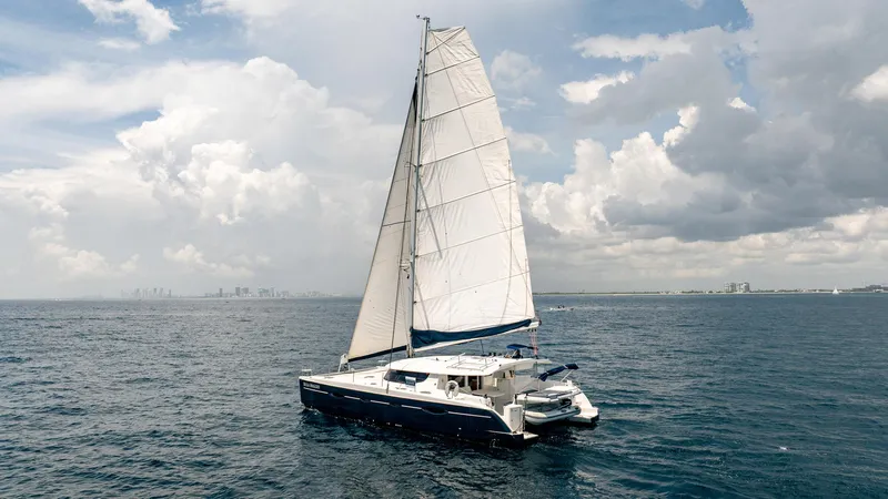 Bellamaggio Yacht Photos Pics Sailing catamaran Fountaine Pajot Salina 48 Evolution, 2008, on open sea under cloudy sky.