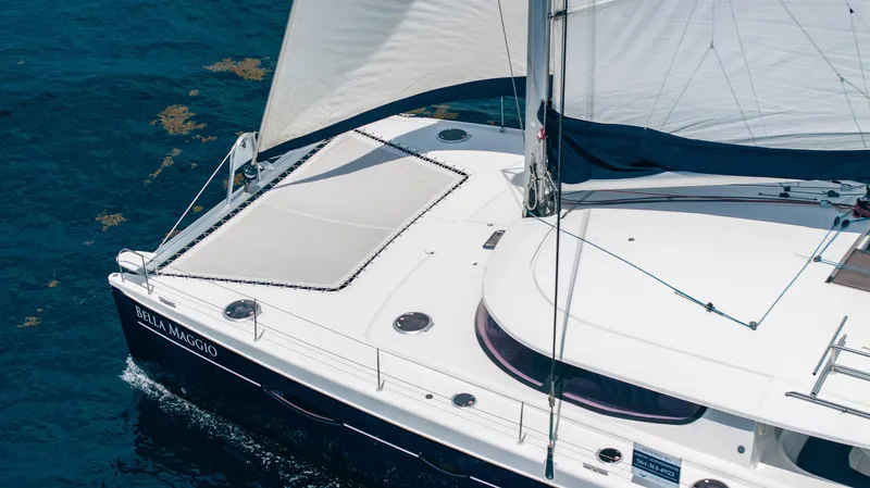 Bellamaggio Yacht Photos Pics 2008 Fountaine Pajot Salina 48 Evolution sailing on clear blue water.