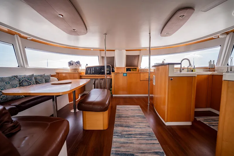 Bellamaggio Yacht Photos Pics Spacious interior of 2008 Fountaine Pajot Salina 48 Evolution catamaran with modern kitchen and seating area.