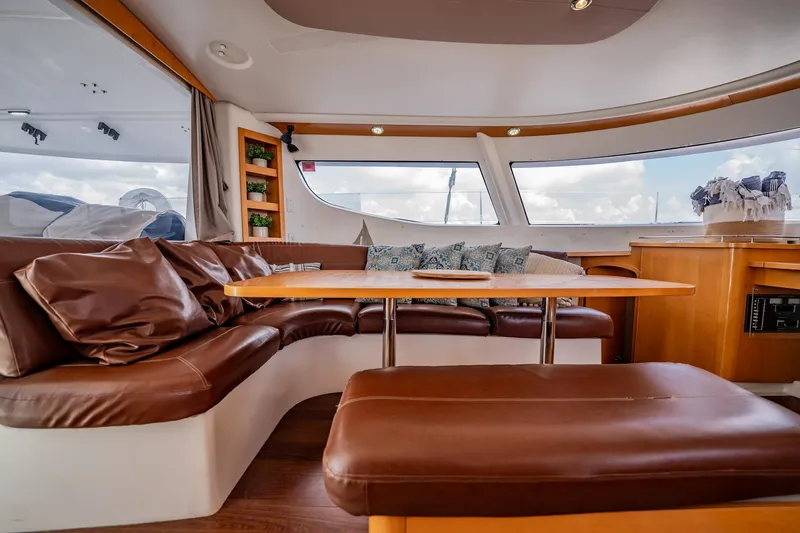 Bellamaggio Yacht Photos Pics Luxurious interior of 2008 Fountaine Pajot Salina 48 Evolution catamaran with leather seating and panoramic windows.