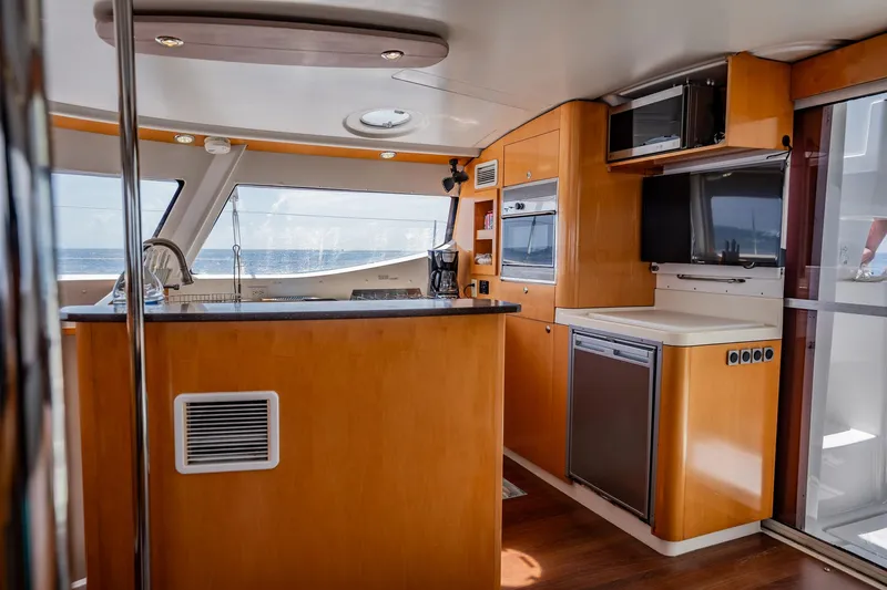 Bellamaggio Yacht Photos Pics Interior of 2008 Fountaine Pajot Salina 48 Evolution yacht, featuring modern kitchen and ocean view.