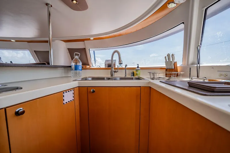 Bellamaggio Yacht Photos Pics Interior of 2008 Fountaine Pajot Salina 48 Evolution yacht kitchen with modern amenities.