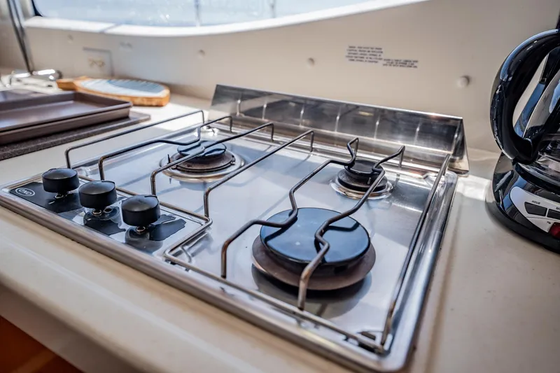 Bellamaggio Yacht Photos Pics Stainless steel stove in 2008 Fountaine Pajot Salina 48 Evolution yacht kitchen.