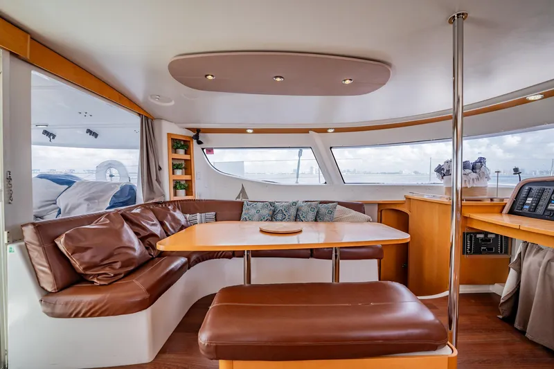 Bellamaggio Yacht Photos Pics Luxurious interior of 2008 Fountaine Pajot Salina 48 Evolution catamaran with leather seating and panoramic windows.