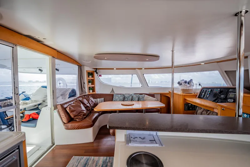 Bellamaggio Yacht Photos Pics Interior of 2008 Fountaine Pajot Salina 48 Evolution catamaran, featuring spacious seating and navigation area.