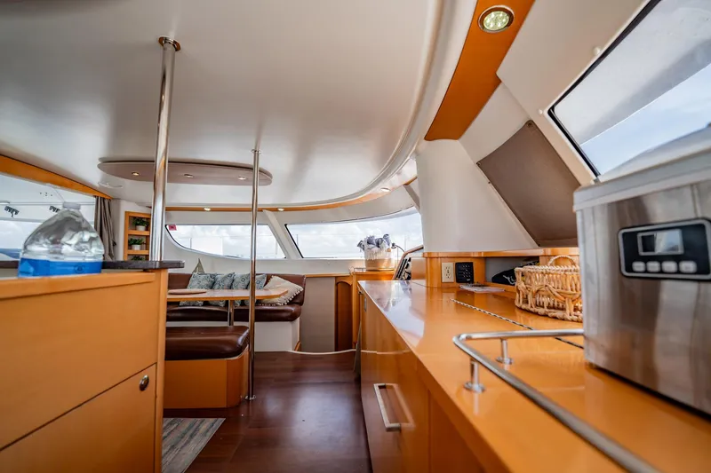 Bellamaggio Yacht Photos Pics Interior of 2008 Fountaine Pajot Salina 48 Evolution yacht, featuring modern kitchen and seating area.