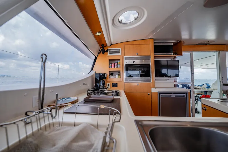 Bellamaggio Yacht Photos Pics Interior of 2008 Fountaine Pajot Salina 48 Evolution yacht kitchen with ocean view.