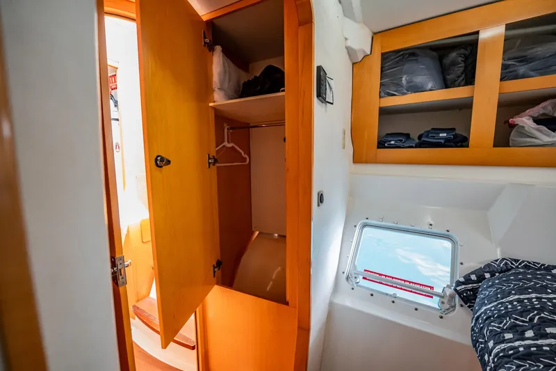 Bellamaggio Yacht Photos Pics Interior cabin of 2008 Fountaine Pajot Salina 48 Evolution with open closet and window.